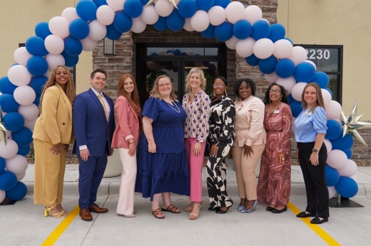 The Mindful Health Cypress team stands in front of the new clinic building.