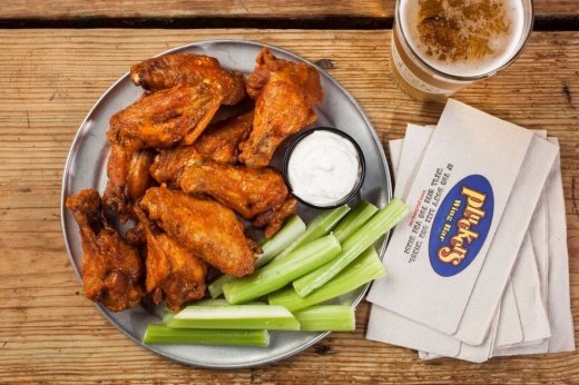 Pluckers Wing Bar serves chicken wings with a variety of sauce options. (Photo by Melissa Skorpil, courtesy Pluckers Wing Bar)