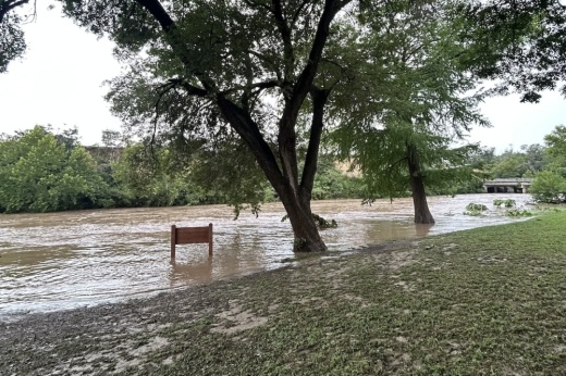 The Guadalupe River along Common Street in New Braunfels with an influx of water caused by rain. (Community Impact staff)