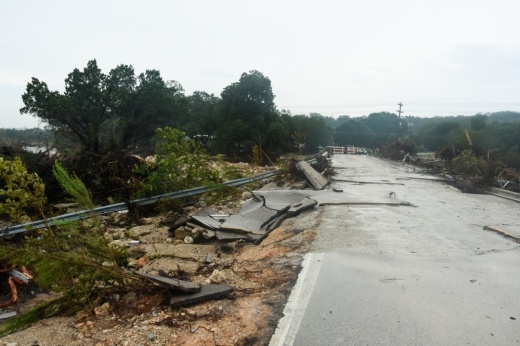 Multiple agencies are working to restore bridge access into the Sandy Creek community after severe flooding over the first weekend of July 2025. (Sam Schaffer/Community Impact)