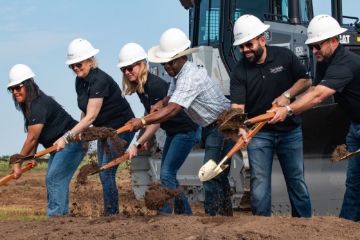 Bastrop Mayor Ishmael Harris and members of the PulteGroup team set the Del Webb Lost Pines development into action during a groundbreaking ceremony July 10. (Joel Valley/Community Impact)