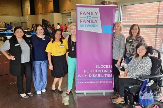 Mary Jane Williams (right of banner) was executive director of the organization for 15 years. (Courtesy Family to Family Network)