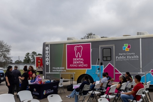 A photo of Harris County Public Health workers with clients outside