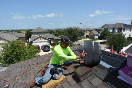 A man working on a roof.