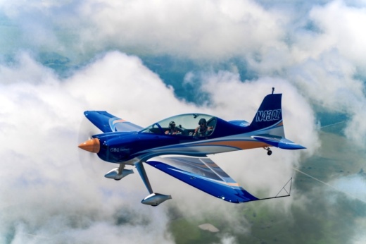 a Thrust Flight plane in the sky