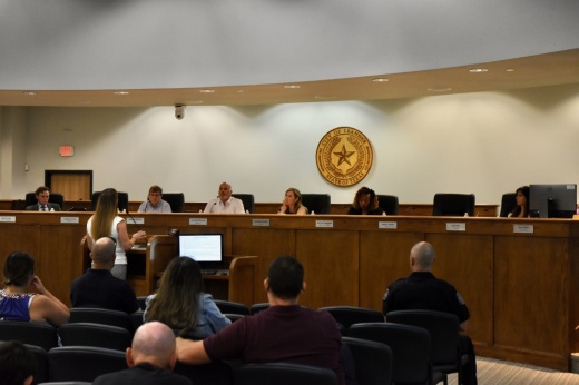 Image is a wide shot of Leander City Council Chambers during a meeting.