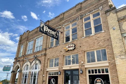 Outside of the historic builign with the Proset Alehouse signage