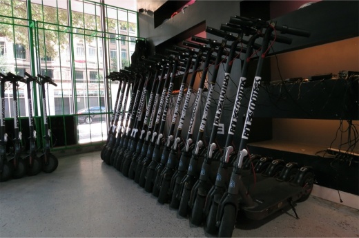 electric scooters in a row
