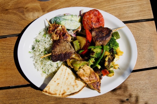kabob plate with rice and vegetables