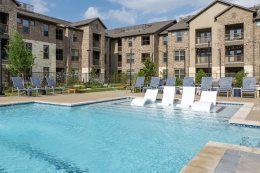 a pool area of an apartment complex