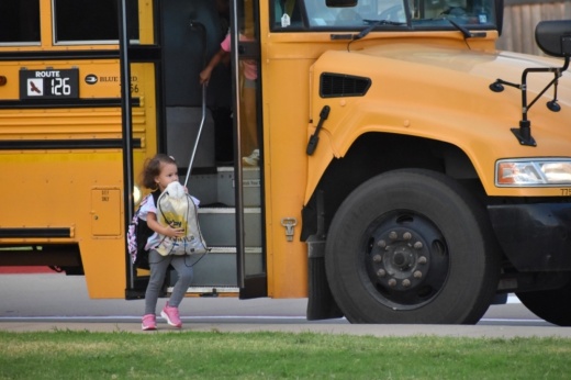 Student getting off bus