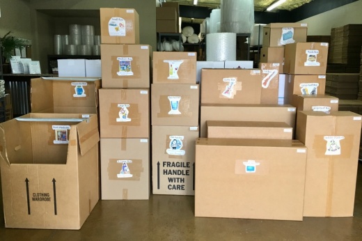 Stacks of brown moving boxes in a room