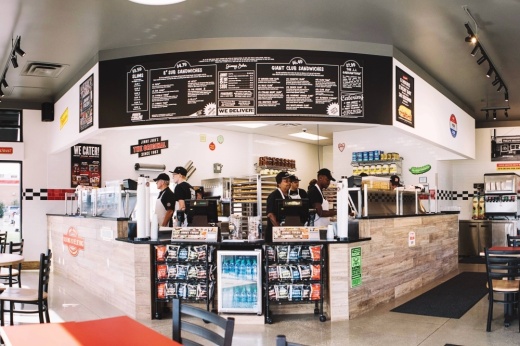 The front counter of a Jimmy John's restaurant is shown.