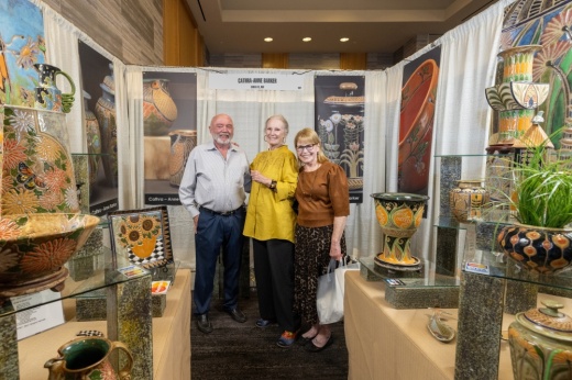 three people in an art studio