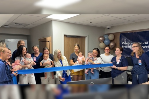 An image of the ribbon cutting of the new site.