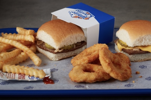 a fast food restaurant's french fries, burger sliders and chicken rings on a tray