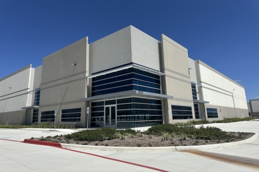 The grey exterior is shown against a deep blue sky.