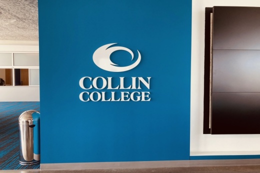 The Collin College symbol on a building wall