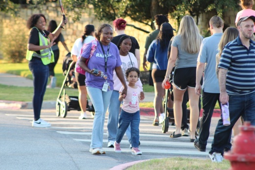 Families walk to Linda Herrington Elementary School for the first day of class Aug. 12. (Grant Crawford/Community Impact)