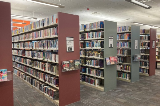 Rows of bookshelves filled with books at a library