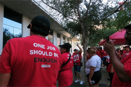 people on strike outside of a building