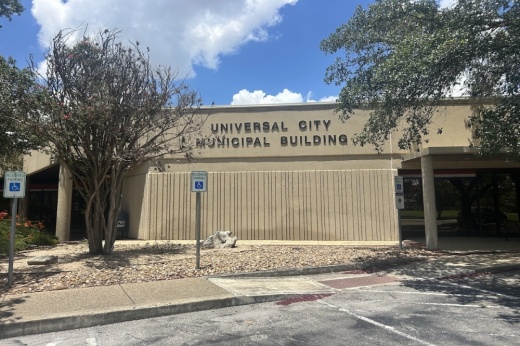 The exterior of a city administration building is shown on a partly cloudy day in Universal City, Texas.
