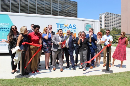 People cut a ribbon