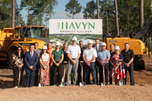 people wearing hard hats in front of construction equipment