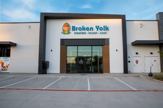 Exterior of a restaurant featuring Broken Yolk Cafe signage.