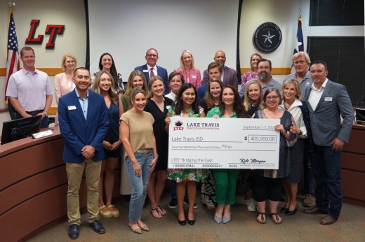LTISD board of trustees and Lake Travis Education Foundation members with a $405,000 check