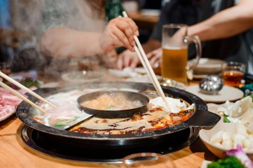 The restaurant offers a variety of hot pot and barbeque dishes, as well as sweet fruit teas and ice cream shakes. (Courtesy Adobe Stock)