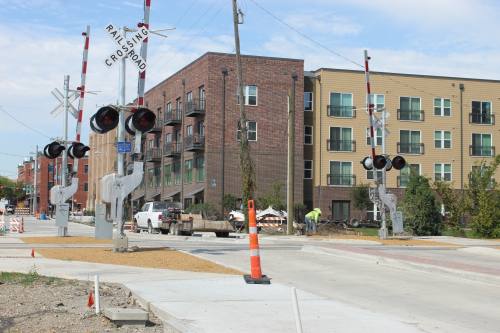 traffic cone in a road with a railroad crossing