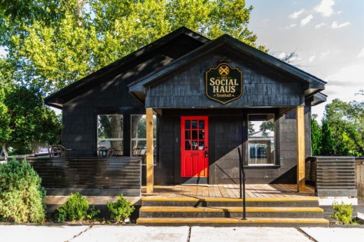 a black house with a red door