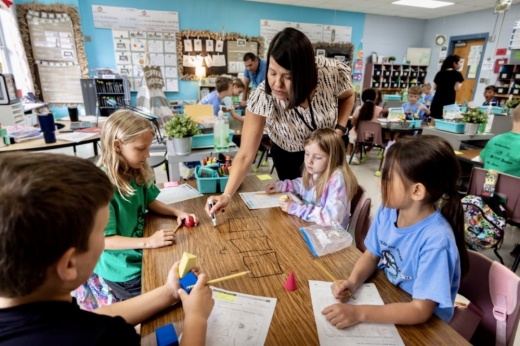 Teacher in classroom with students