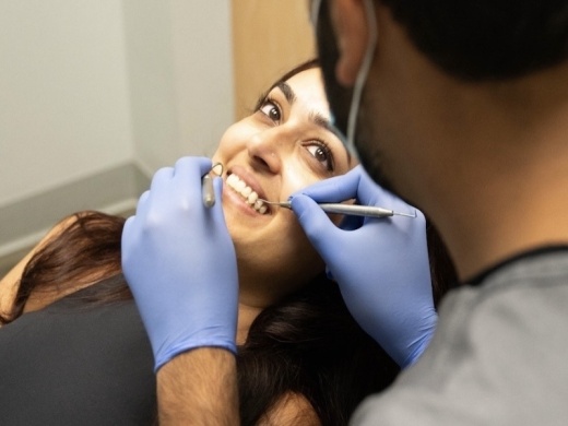A woman receiving a teeth cleaning