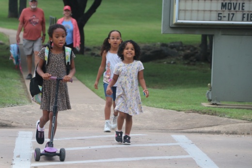 Georgetown ISD students walk and ride scooters to school.