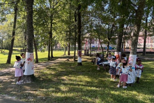 A photo of students completing art projects outside