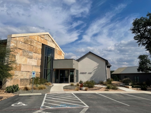 exterior of a building with handicap parking out front