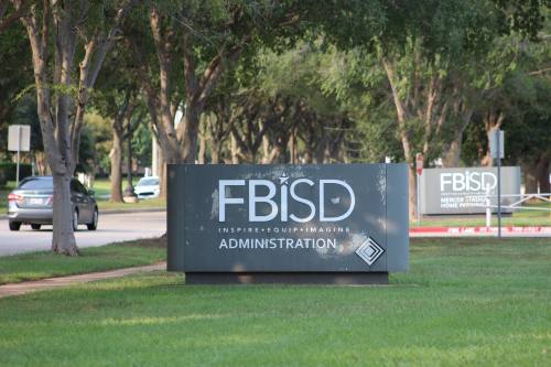 sign on grass that says FBISD