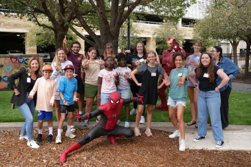 An image of a group of the nonprofit's team with Spiderman.