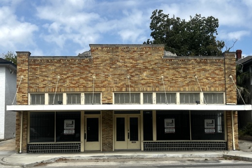 brick building with a white awning