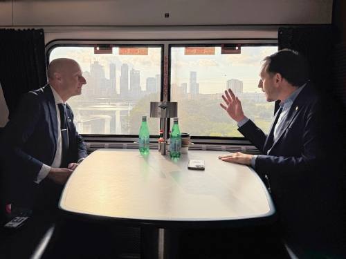 Andy Byford, Amtrak senior vice president of high speed rail development, and Travis County Judge Andy Brown onboard the Amtrak Texas Eagle passing Lady Bird Lake in Austin on Sept. 23, 2024. (Courtesy Travis County)