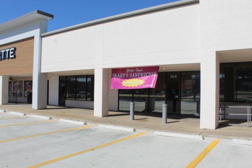 A purple coming soon sign announcing the new Snarf's Sandwiches location.