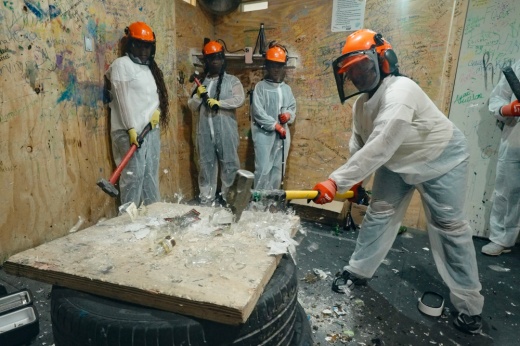 Children and adults participating in a paint splatter session at Maximum Rage Humble, Texas, a family-friendly rage room offering safe, high-energy activities for fun, creativity, and cathartic experiences.