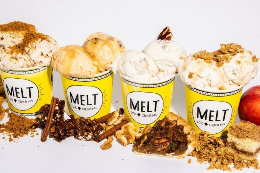 Several cups of ice cream in a line