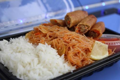 The lumpia bowl ($13.99) comes with six lumpias, pancit and garlic fried rice. (Andrew Creelman/Community Impact)