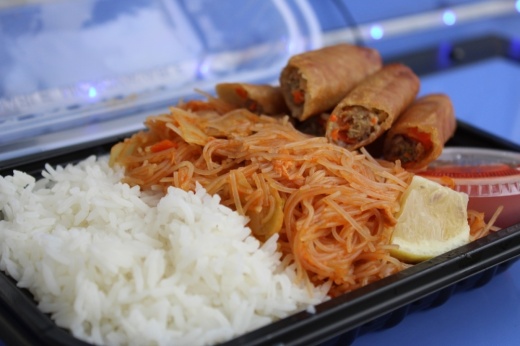 The lumpia bowl ($13.99) comes with six lumpias, pancit and garlic fried rice. (Andrew Creelman/Community Impact)