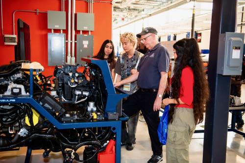 People looking at car parts