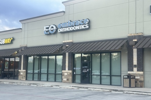 The exterior of an orthodontist's office is seen on a cloudy day in Cibolo, Texas.