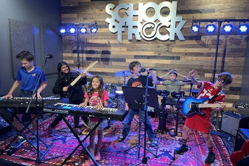 kids play musical instruments in a band